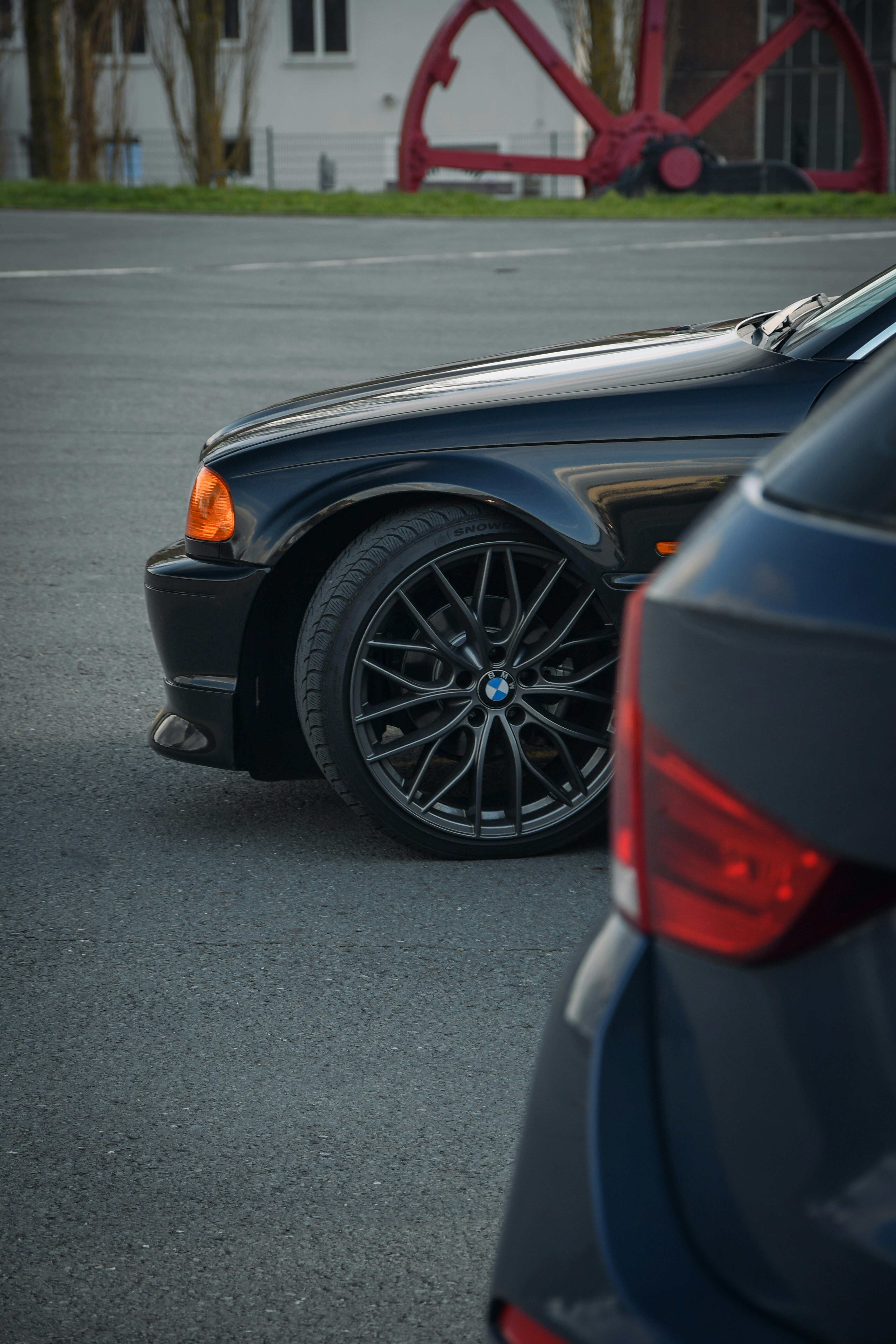 black car on gray asphalt road during daytime